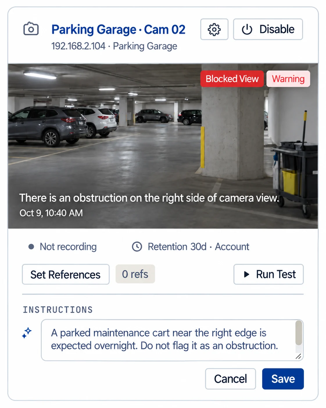 An ImageAssure camera card flagged Blocked View, with an instruction added in plain English: a parked maintenance cart near the right edge is expected overnight, so do not flag it as an obstruction.